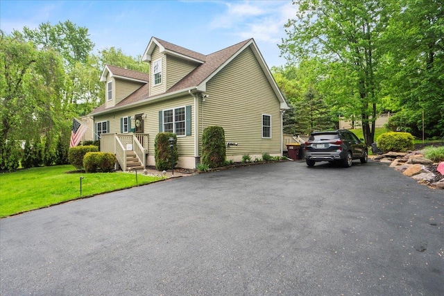 3 Pine Ln, Greenwood Lake, NY 10925 - view of side of property featuring a lawn, roof with shingles, and driveway