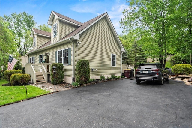 3 Pine Ln, Greenwood Lake, NY 10925 - view of side of property with a shingled roof and driveway