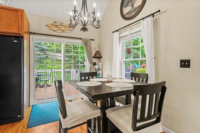 3 Pine Ln, Greenwood Lake, NY 10925 - dining area with a chandelier, light wood finished floors, and lofted ceiling