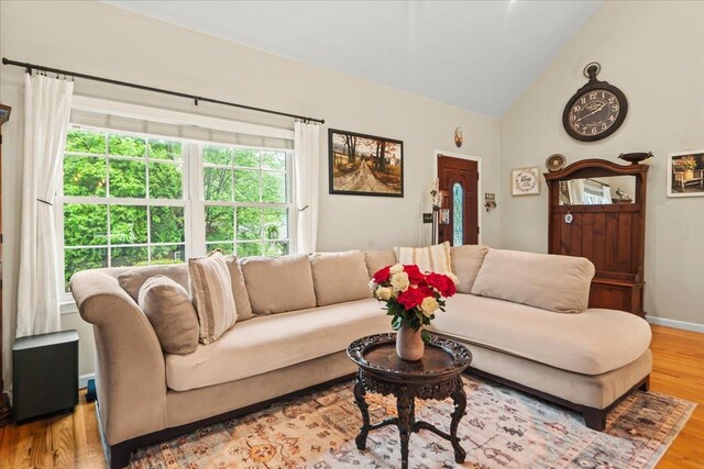 3 Pine Ln, Greenwood Lake, NY 10925 - living area with wood finished floors, high vaulted ceiling, and baseboards