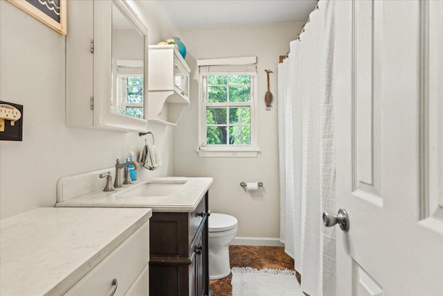 3 Pine Ln, Greenwood Lake, NY 10925 - bathroom featuring vanity, toilet, and baseboards