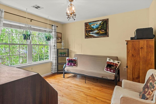 3 Pine Ln, Greenwood Lake, NY 10925 - sitting room with a chandelier, wood finished floors, and baseboards