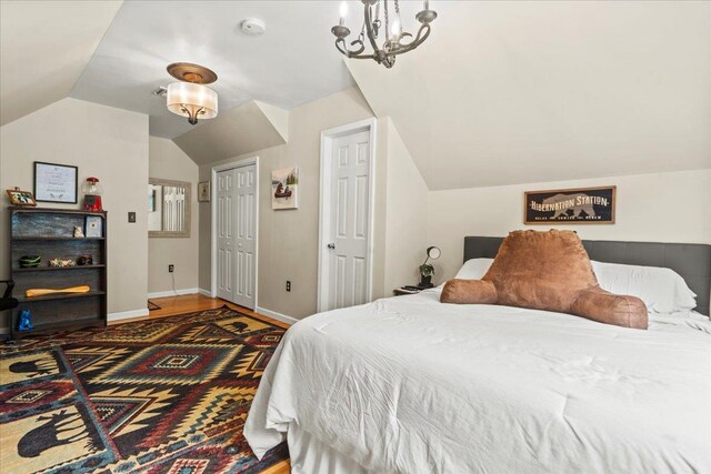 3 Pine Ln, Greenwood Lake, NY 10925 - bedroom with vaulted ceiling, a chandelier, baseboards, and a closet