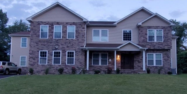 4 Coventry Ct, Wheatley Heights, NY 11798 - craftsman-style house with a front lawn, a porch, and stone siding