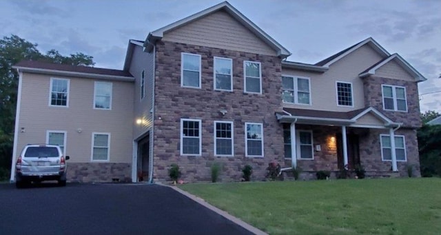 4 Coventry Ct, Wheatley Heights, NY 11798 - view of front facade with stone siding and a front lawn