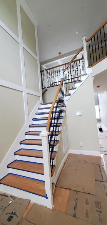 4 Coventry Ct, Wheatley Heights, NY 11798 - staircase featuring baseboards