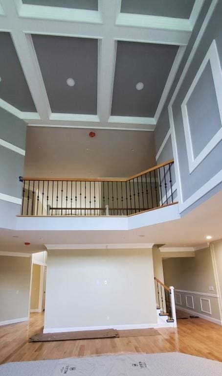 4 Coventry Ct, Wheatley Heights, NY 11798 - stairs with a high ceiling, wood finished floors, coffered ceiling, and beam ceiling
