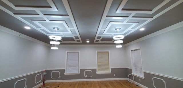 4 Coventry Ct, Wheatley Heights, NY 11798 - spare room featuring coffered ceiling, ornamental molding, wood finished floors, and a wainscoted wall