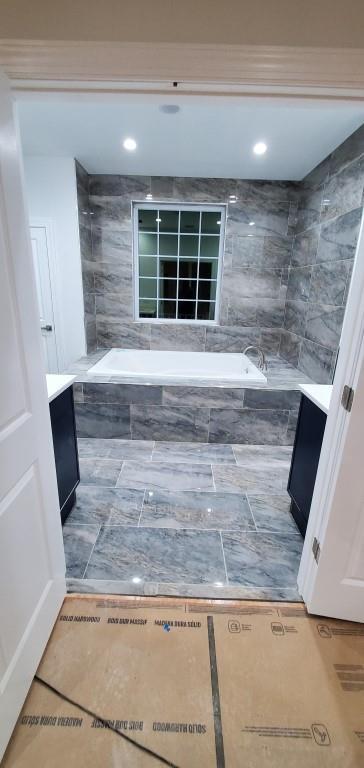 4 Coventry Ct, Wheatley Heights, NY 11798 - full bathroom featuring tile patterned flooring, a bath, vanity, and recessed lighting