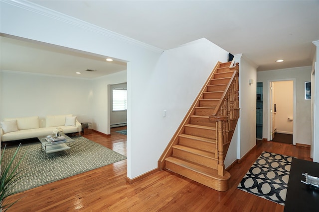 2448 6th Ave, East Meadow, NY 11554 - staircase with crown molding, baseboard heating, wood finished floors, recessed lighting, and baseboards