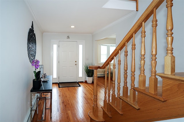 2448 6th Ave, East Meadow, NY 11554 - foyer entrance featuring stairs, wood finished floors, crown molding, recessed lighting, and baseboards