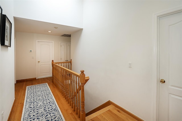 2448 6th Ave, East Meadow, NY 11554 - hall featuring an upstairs landing, light wood-style floors, and baseboards