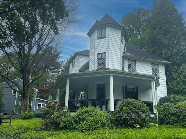 rear view of house with covered porch