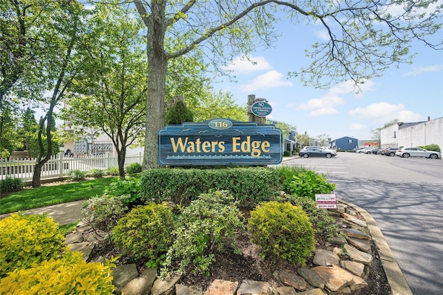 116 Westend Ave Unit 12, Freeport, NY 11520 - community sign with uncovered parking and fence