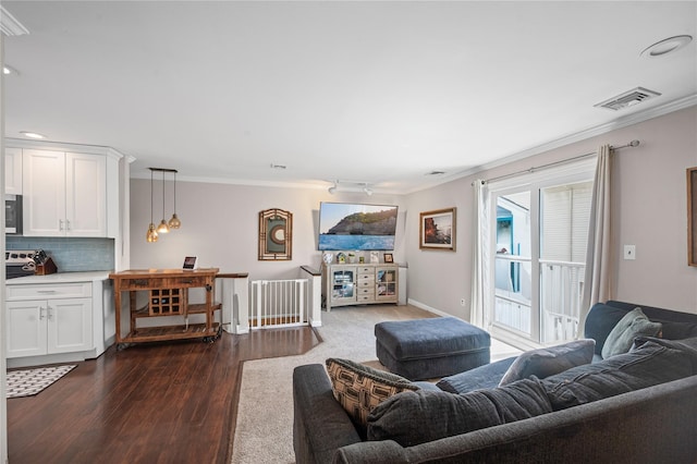 116 Westend Ave Unit 12, Freeport, NY 11520 - living area with crown molding, dark wood-style floors, baseboards, and recessed lighting