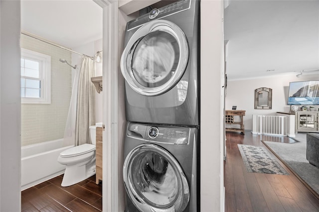 116 Westend Ave Unit 12, Freeport, NY 11520 - laundry area with stacked washer and clothes dryer, wood finished floors, and ornamental molding