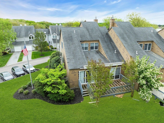 500 Meadow Ct Unit 28, Southold, NY 11971 - back of property with roof with shingles, a chimney, a yard, and a residential view