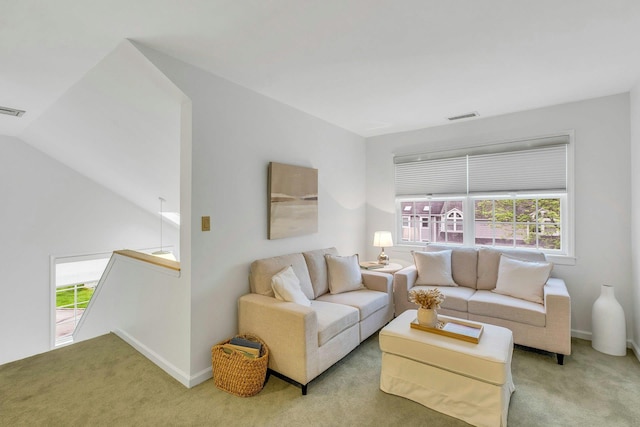 500 Meadow Ct Unit 28, Southold, NY 11971 - carpeted living room featuring healthy amount of natural light and baseboards
