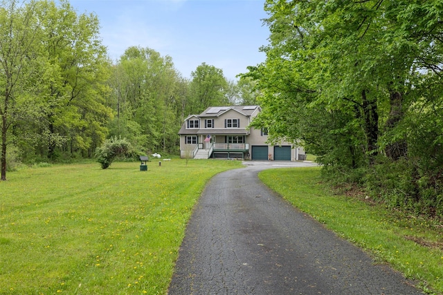 594 County Route 22, Middletown, NY 10940 - colonial inspired home with a front yard, solar panels, asphalt driveway, and a garage