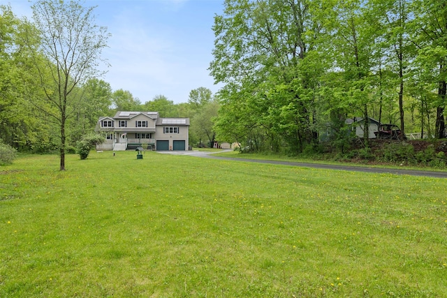 594 County Route 22, Middletown, NY 10940 - view of grassy yard featuring driveway and a garage