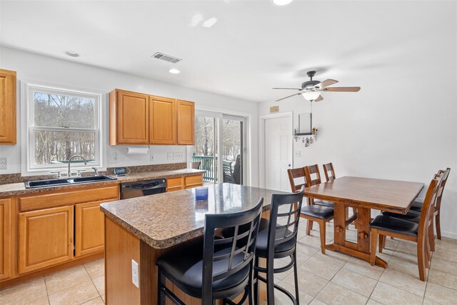 594 County Route 22, Middletown, NY 10940 - kitchen featuring a sink, a kitchen breakfast bar, light tile patterned floors, dishwasher, and recessed lighting