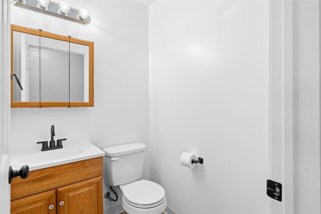 594 County Route 22, Middletown, NY 10940 - half bathroom with toilet, vanity, and baseboards