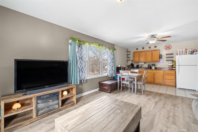 594 County Route 22, Middletown, NY 10940 - living area featuring ceiling fan, light wood-type flooring, and baseboards
