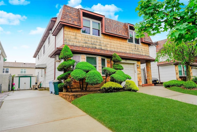 433 Arlene St, Staten Island, NY 10314 - view of front of property featuring concrete driveway, a storage shed, a front yard, and an outdoor structure