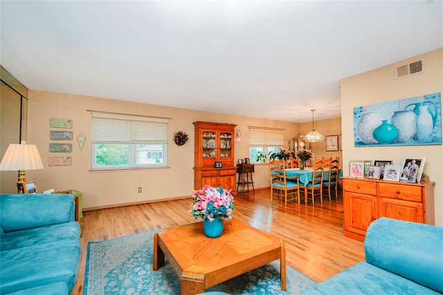 433 Arlene St, Staten Island, NY 10314 - living room with light wood-style flooring, healthy amount of natural light, and baseboards