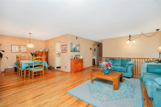433 Arlene St, Staten Island, NY 10314 - living room with light wood finished floors and a chandelier