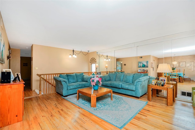 433 Arlene St, Staten Island, NY 10314 - living room with light wood-type flooring and a chandelier