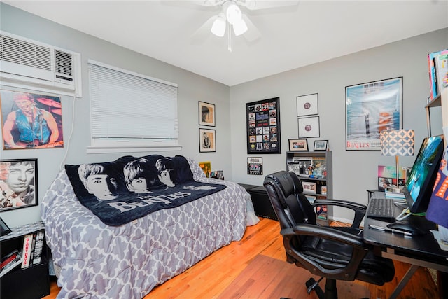 433 Arlene St, Staten Island, NY 10314 - bedroom featuring wood finished floors, a wall unit AC, a desk, and a ceiling fan