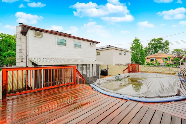433 Arlene St, Staten Island, NY 10314 - wooden terrace with a sunroom, fence, and a wall unit AC