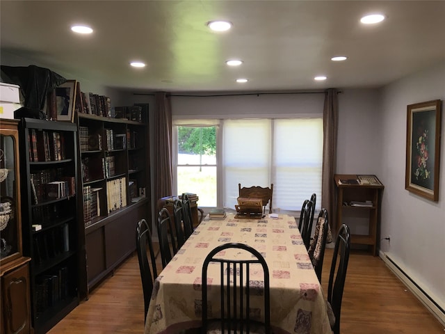 29 Nelshore Dr, Monticello, NY 12701 - dining space with a baseboard radiator, recessed lighting, and wood finished floors