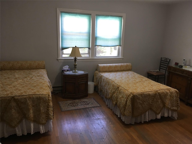 29 Nelshore Dr, Monticello, NY 12701 - bedroom with wood-type flooring and a baseboard radiator