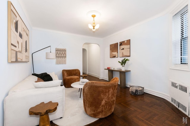35-06 88th St Unit 5E, Jackson Heights, NY 11372 - sitting room featuring radiator heating unit, arched walkways, and a chandelier