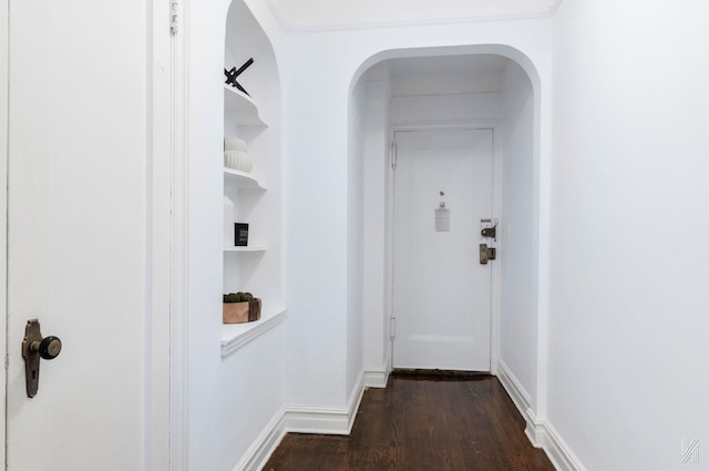 35-06 88th St Unit 5E, Jackson Heights, NY 11372 - hall featuring dark wood-style flooring, baseboards, and arched walkways