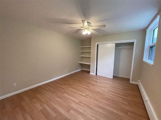 3412 Rte 52, Stormville, NY 12582 - unfurnished bedroom featuring a baseboard radiator, light wood-style flooring, and baseboards