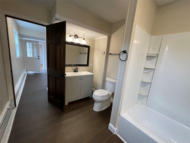 3412 Rte 52, Stormville, NY 12582 - full bathroom featuring toilet, vanity, baseboard heating, wood finished floors, and baseboards