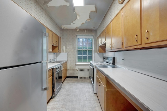 kitchen with freestanding refrigerator, white range with electric stovetop, black dishwasher, radiator heating unit, and light countertops