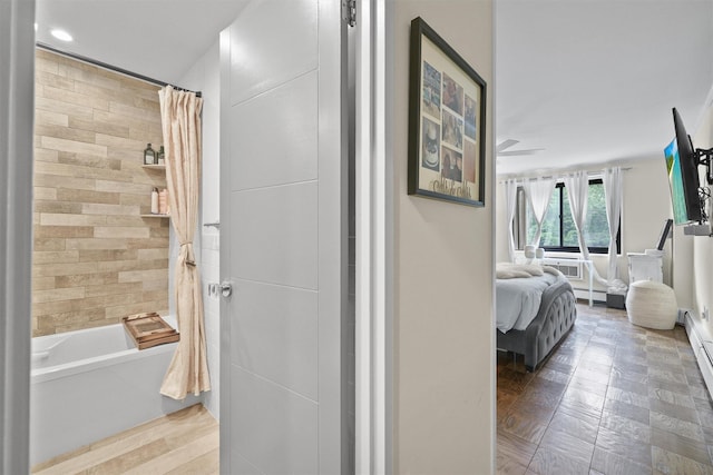 100 E Hartsdale Ave Unit Tfw, Hartsdale, NY 10530 - ensuite bathroom featuring shower / bathtub combination with curtain, a baseboard heating unit, and recessed lighting
