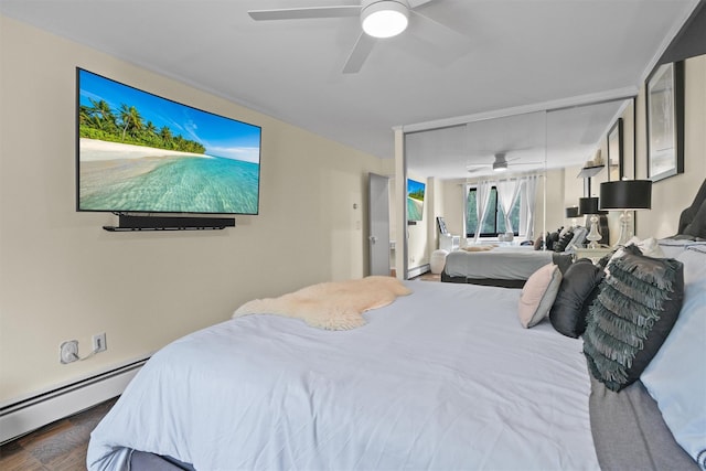 100 E Hartsdale Ave Unit Tfw, Hartsdale, NY 10530 - bedroom featuring a baseboard heating unit, a baseboard radiator, a ceiling fan, and dark wood-style flooring