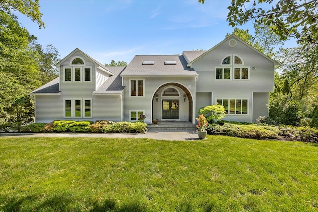 47 Londonderry Ln, Somers, NY 10589 - view of front facade with a front yard, roof with shingles, and a porch