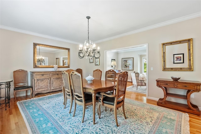 47 Londonderry Ln, Somers, NY 10589 - dining space featuring a chandelier, crown molding, light wood-style floors, and baseboards