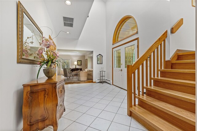 47 Londonderry Ln, Somers, NY 10589 - foyer featuring a towering ceiling, stairway, light tile patterned floors, recessed lighting, and baseboard heating