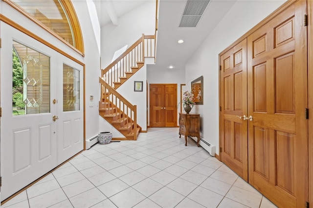 47 Londonderry Ln, Somers, NY 10589 - foyer entrance with stairway, a baseboard heating unit, recessed lighting, and light tile patterned floors