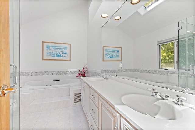 47 Londonderry Ln, Somers, NY 10589 - bathroom with lofted ceiling, a garden tub, double vanity, tile patterned flooring, and a skylight