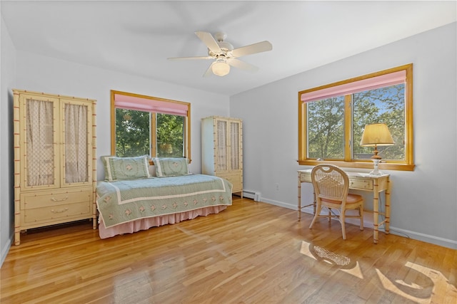 47 Londonderry Ln, Somers, NY 10589 - bedroom featuring a baseboard heating unit, wood finished floors, baseboards, and ceiling fan