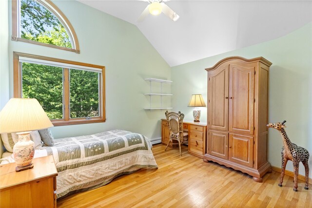 47 Londonderry Ln, Somers, NY 10589 - bedroom with vaulted ceiling, light wood-style flooring, a baseboard radiator, a ceiling fan, and baseboards