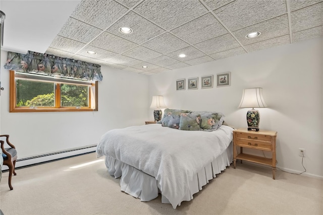 47 Londonderry Ln, Somers, NY 10589 - bedroom featuring light colored carpet, a baseboard heating unit, recessed lighting, baseboards, and a paneled ceiling
